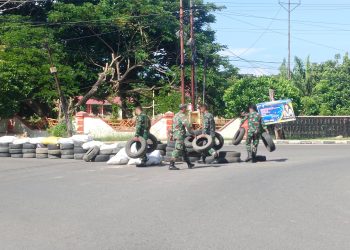 Anggota Kodim 1313 Pohuwato Bersihkan Sampah Usai Dandim Cup Race