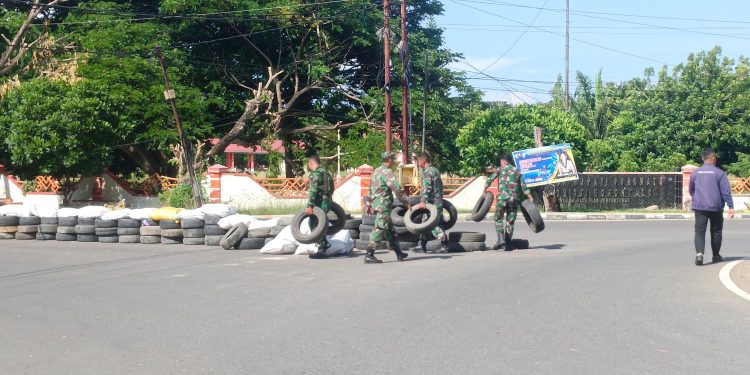 Anggota Kodim 1313 Pohuwato Bersihkan Sampah Usai Dandim Cup Race